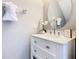 Well-lit bathroom with white vanity, modern fixtures, and decorative mirror at 2705 Grand Harbour Ct, Kissimmee, FL 34747