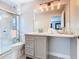 A neutral tone bathroom featuring modern fixtures and a glass shower at 2705 Grand Harbour Ct, Kissimmee, FL 34747