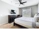Bedroom with a large bed, dark wood furniture, ceiling fan, and a backyard view at 2705 Grand Harbour Ct, Kissimmee, FL 34747