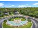 Community entrance featuring lush landscaping and a water fountain at 2705 Grand Harbour Ct, Kissimmee, FL 34747
