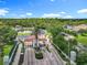 Scenic aerial view of the community's entrance, showcasing manicured landscaping, and grand gate at 2705 Grand Harbour Ct, Kissimmee, FL 34747