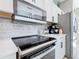 Modern kitchen with stainless steel appliances and white cabinetry offering a clean, contemporary design at 2705 Grand Harbour Ct, Kissimmee, FL 34747