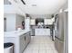 Bright kitchen with stainless steel appliances, modern fixtures, and ample cabinet space at 2705 Grand Harbour Ct, Kissimmee, FL 34747