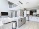 Open concept kitchen with modern appliances and finishes flowing into the living area at 2705 Grand Harbour Ct, Kissimmee, FL 34747