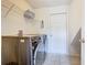 Laundry room with tile flooring, modern washer and dryer set and utility storage at 2705 Grand Harbour Ct, Kissimmee, FL 34747