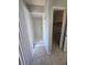 Bright bathroom featuring a walk-in shower with tiled walls, and access to a closet, promoting comfort and practicality at 2798 Beckwith St, Deltona, FL 32738