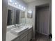 Bathroom with a modern vessel sink, a large mirror, and updated lighting fixtures at 2798 Beckwith St, Deltona, FL 32738