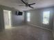 Bedroom with neutral walls, tiled floors, two windows and a ceiling fan at 2798 Beckwith St, Deltona, FL 32738