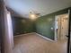 Large bedroom with modern ceiling fan, tile floors, natural lighting from a window, and connecting doorway at 2798 Beckwith St, Deltona, FL 32738