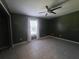 Spacious bedroom featuring tile flooring, ceiling fan, neutral walls, and plenty of natural light from a window at 2798 Beckwith St, Deltona, FL 32738