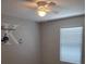Charming bedroom featuring a ceiling fan, and a window with blinds at 2798 Beckwith St, Deltona, FL 32738