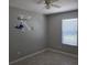 Cozy bedroom with a ceiling fan, window with blinds and custom wall decor at 2798 Beckwith St, Deltona, FL 32738