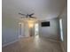Bedroom with tiled floors, ceiling fan, television and ensuite bathroom at 2798 Beckwith St, Deltona, FL 32738