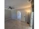 Comfortable bedroom featuring tile floors, a ceiling fan, and neutral wall color at 2798 Beckwith St, Deltona, FL 32738