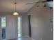Bright dining room featuring ceramic tile floors, a pendant light fixture, and sliding glass doors to the outside at 2798 Beckwith St, Deltona, FL 32738