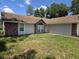 Home's exterior features a combination of brick and siding, and a well-manicured lawn at 2798 Beckwith St, Deltona, FL 32738