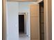 Hallway featuring tile flooring, a storage closet and neutral colored walls at 2798 Beckwith St, Deltona, FL 32738