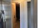 Hallway with a view into the garage and a closet with bi-fold doors at 2798 Beckwith St, Deltona, FL 32738