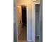 Hallway with a view into the garage and a closet with bi-fold doors at 2798 Beckwith St, Deltona, FL 32738