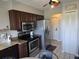 Kitchen featuring stainless steel appliances, a microwave, and granite countertops at 2798 Beckwith St, Deltona, FL 32738