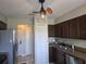 Kitchen with stainless appliances, granite countertops, and a bright ceiling fan at 2798 Beckwith St, Deltona, FL 32738