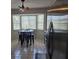 Bright kitchen area with stainless steel refrigerator, table and chairs at 2798 Beckwith St, Deltona, FL 32738