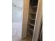 Kitchen pantry with open shelving for optimal storage and organization at 2798 Beckwith St, Deltona, FL 32738