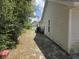 Home's side yard exterior features traditional siding and standard windows at 2798 Beckwith St, Deltona, FL 32738