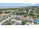 An aerial view of a quiet residential neighborhood near a lake at 2980 Cool Breeze Cir, St Cloud, FL 34769