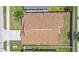 An aerial view of the roof, with backyard, white fencing, and green landscape at 2980 Cool Breeze Cir, St Cloud, FL 34769