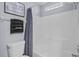 Bright bathroom featuring a tub and shower combo, modern fixtures, and neutral color palette at 2980 Cool Breeze Cir, St Cloud, FL 34769