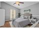 Calm main bedroom boasts a ceiling fan, and neutral tones at 2980 Cool Breeze Cir, St Cloud, FL 34769