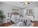 This comfortable main bedroom boasts a ceiling fan and neutral paint scheme at 2980 Cool Breeze Cir, St Cloud, FL 34769