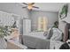 Charming main bedroom with ceiling fan, natural light, and neutral walls at 2980 Cool Breeze Cir, St Cloud, FL 34769