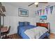 Well-appointed bedroom features wood floors, a ceiling fan, and a comfortable-looking bed at 2980 Cool Breeze Cir, St Cloud, FL 34769