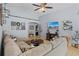Inviting living room with ample seating, decor, and natural light, perfect for entertaining guests at 2980 Cool Breeze Cir, St Cloud, FL 34769