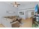 Spacious living area with tile flooring, comfortable seating, and decorative accents at 2980 Cool Breeze Cir, St Cloud, FL 34769