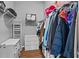 Spacious walk-in closet features wire shelving, dresser, and ample storage space for an organized wardrobe at 2980 Cool Breeze Cir, St Cloud, FL 34769