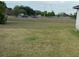 Large grassy backyard offers plenty of space for outdoor activities and relaxation at 3 Spur Ct, Kissimmee, FL 34743
