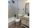 Bathroom with modern vanity, fixtures, and tiled shower-bath at 3 Spur Ct, Kissimmee, FL 34743