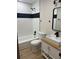 Bathroom with modern vanity, fixtures, and tiled shower-bath at 3 Spur Ct, Kissimmee, FL 34743