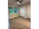 Bedroom featuring double closets, fan, and natural light from window at 3 Spur Ct, Kissimmee, FL 34743