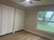 Bedroom featuring double closets, fan, and natural light from window at 3 Spur Ct, Kissimmee, FL 34743