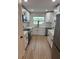 Newly renovated kitchen with stainless steel appliances, white cabinets, and quartz countertops at 3 Spur Ct, Kissimmee, FL 34743