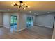 Open living room with recessed lighting and sliding doors to an outdoor covered patio at 3 Spur Ct, Kissimmee, FL 34743