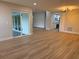 Open-concept living area showcasing sleek flooring and seamless flow to adjacent kitchen at 3 Spur Ct, Kissimmee, FL 34743