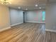 Large, open living room with sleek flooring and a neutral color palette, ready for personalization at 3 Spur Ct, Kissimmee, FL 34743