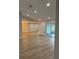 Open living room area with bright recessed lighting and view to the outdoor patio at 3 Spur Ct, Kissimmee, FL 34743