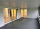 Covered patio with views of interiors through sliding glass doors at 3 Spur Ct, Kissimmee, FL 34743