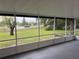 Screened porch with views of the nearby neighborhood at 3 Spur Ct, Kissimmee, FL 34743